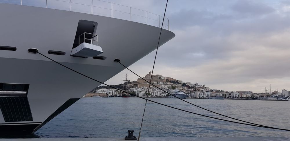 Yacht bow with the old town of Ibiza in the background